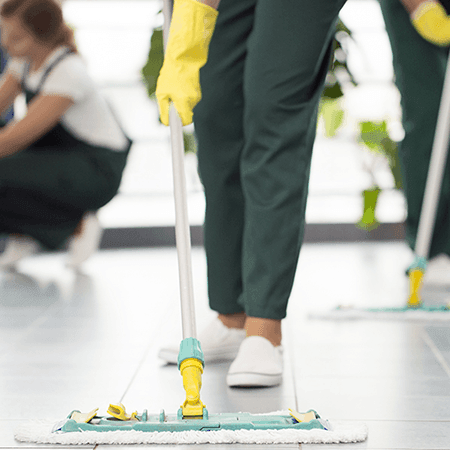 Golden State cleaning employee moping the floor at the USDA office in Corona, California